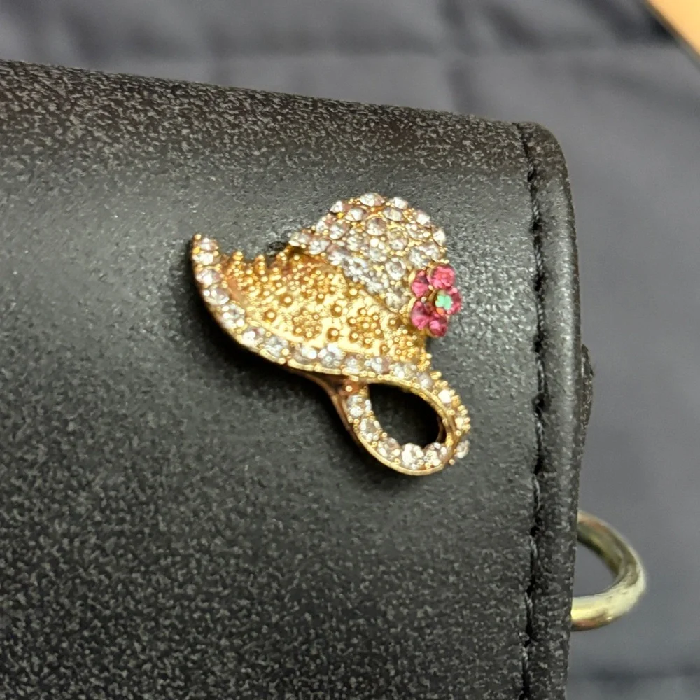Crossbody bag is embellished with rhinestone motifs - NWT